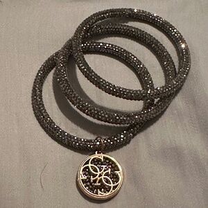 Set of three Guess crystal bangels.